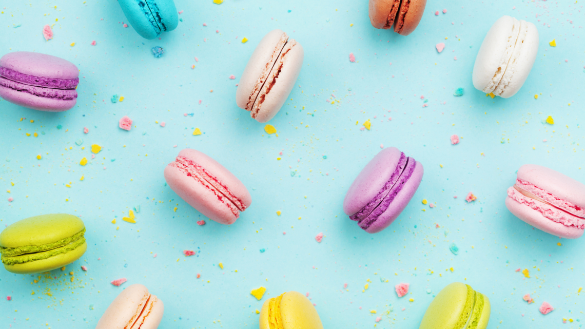 colorful macarons with blue background
