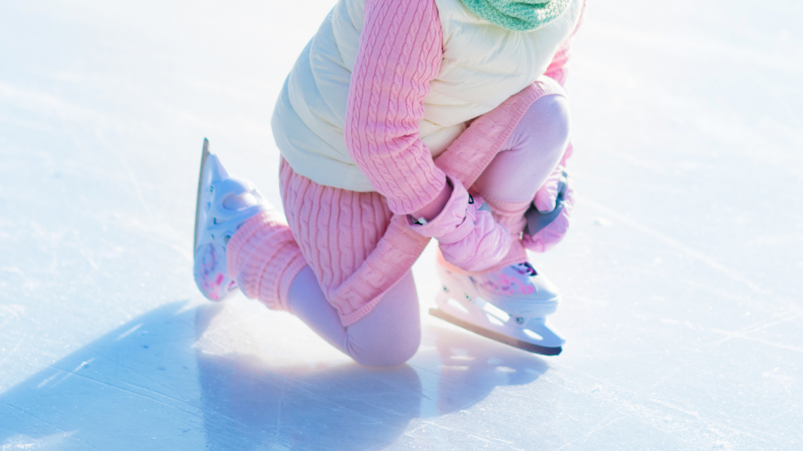 kid tying ice skate